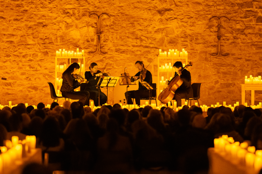 Musicians playing in candlelight