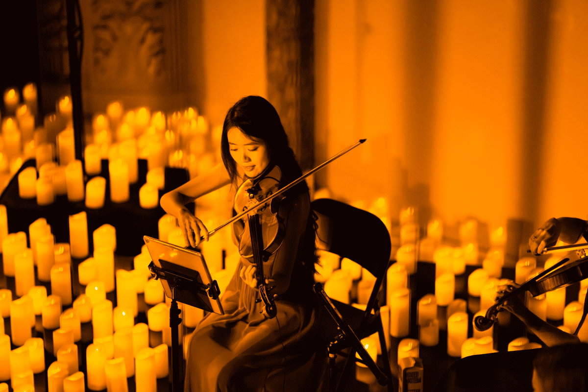 A violinist performing at a Candlelight concert