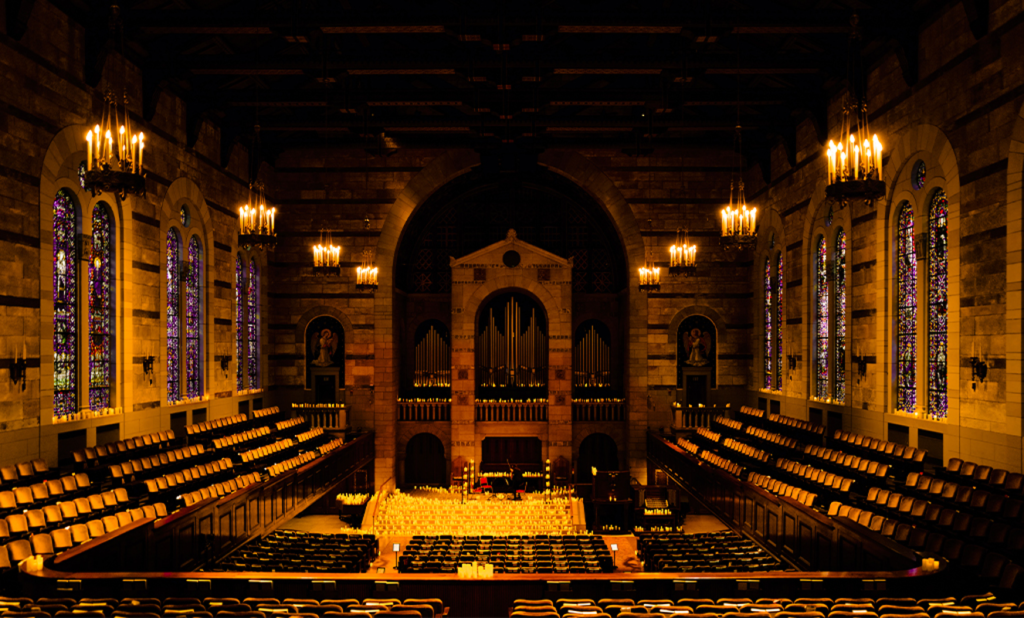 The sanctuary of Fountain Street Church in Grand Rapids illuminated by candlelight