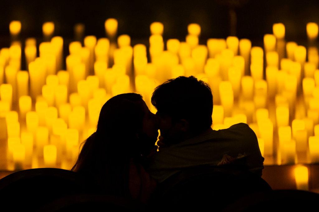 A couple getting cosy at a Candlelight concert