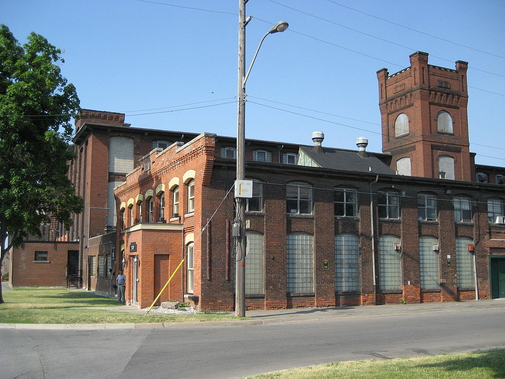 The red, brick exterior of The Cotton Factory in Hamilton.