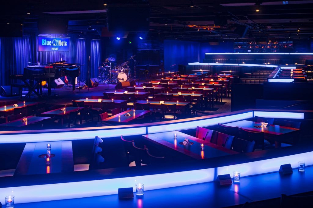 The vast interior of Blue Note Hawaii, lluminated by blue light.