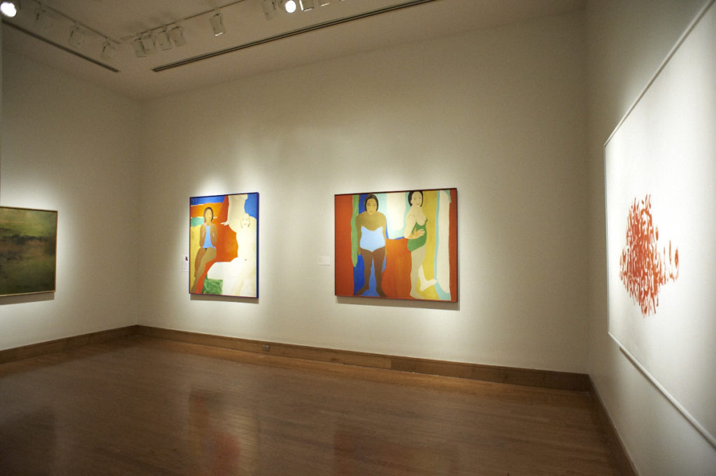 Several vibrant paintings hanging at the Birmingham Museum of Art. 