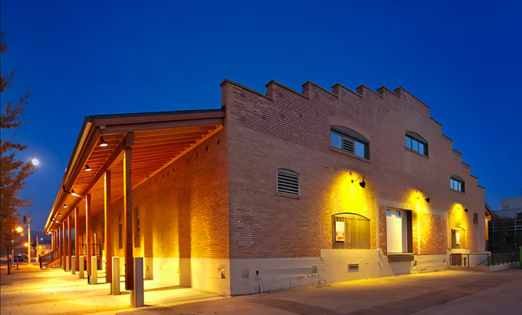 The exterior of The Laurel Packinghouse illumianated by soft lighting.